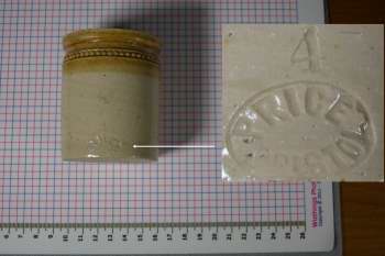 Brown salt glazed jar with maker's mark as an inset
