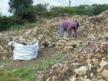 Recovering stones from dump