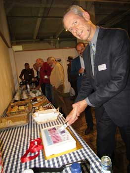 Cutting the birthday cake at the conference